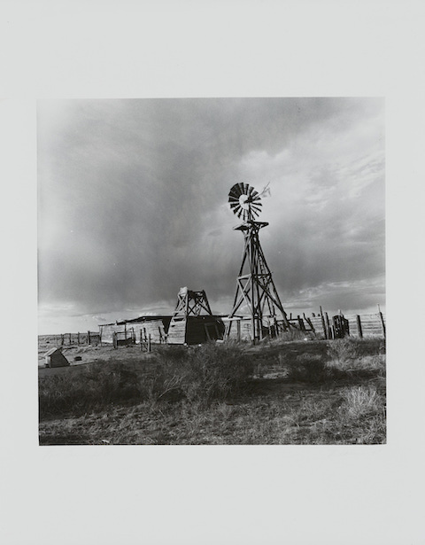 open landscape with windmill and clouds